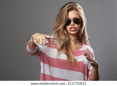 cool girl doing hand gestures as rap
