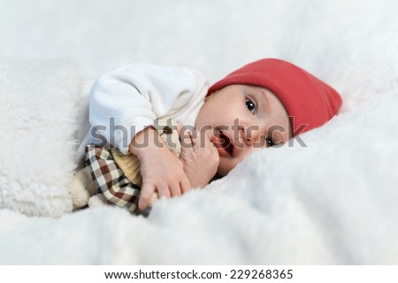 cute baby in red hat smiling