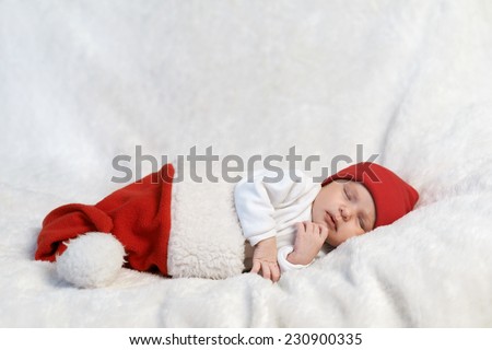 cute baby sleeping in Santa hats