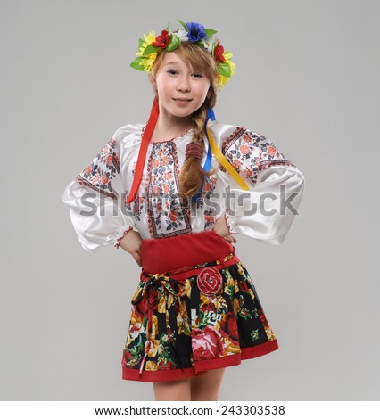 Pretty red-haired girl in the Slavic national costume