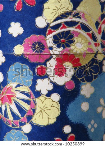 A bright and colorful flower and balloon pattern on fabric.