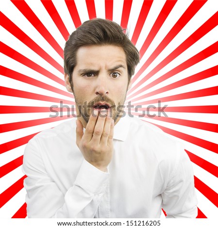 young handsome man afraid isolated over gray background