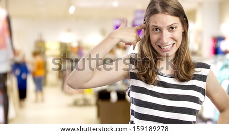 young girl with crazy gesture in a market