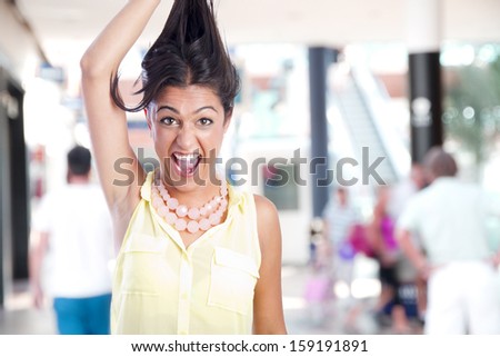 crazy girl gesture in a shopping center