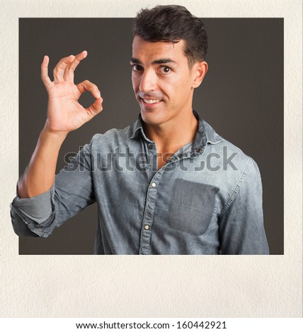 young man all right gesture on photo frame