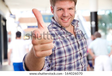 young man pointing you gesture