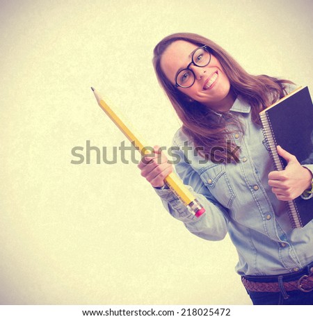 young woman holding pencil and notebook. isolated