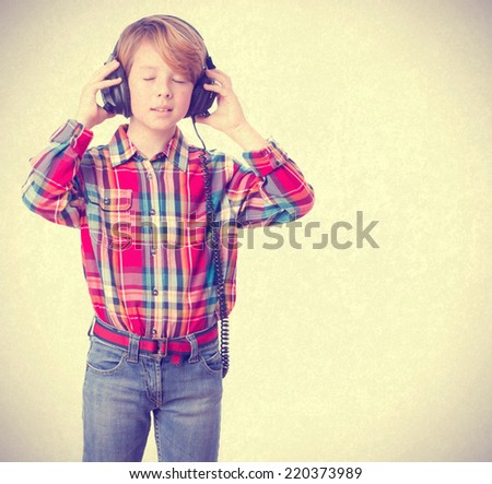 Boy listening music with an headphones