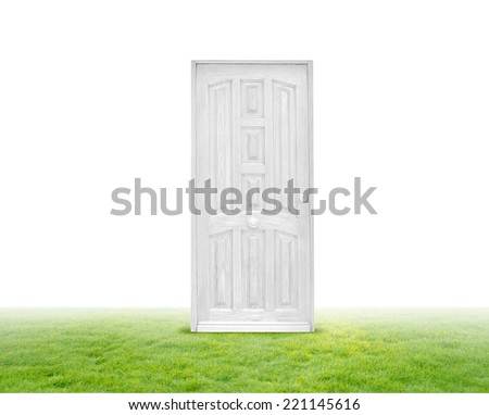white door on green grass