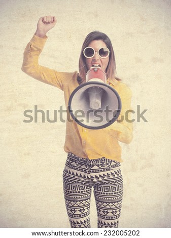 young cool woman shouting on megaphone