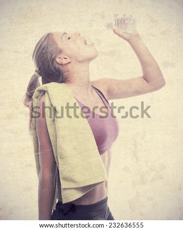 young cool woman with towel and drinking water