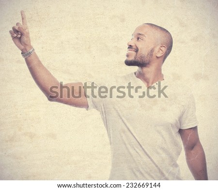 young cool black man pointing up