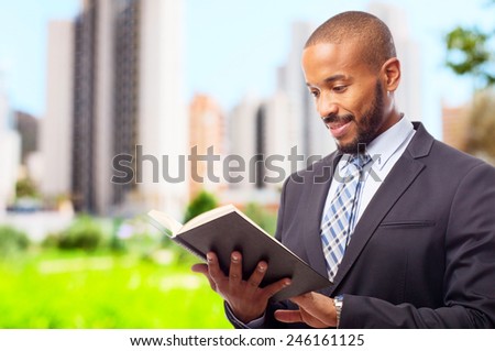 young cool black man with a book
