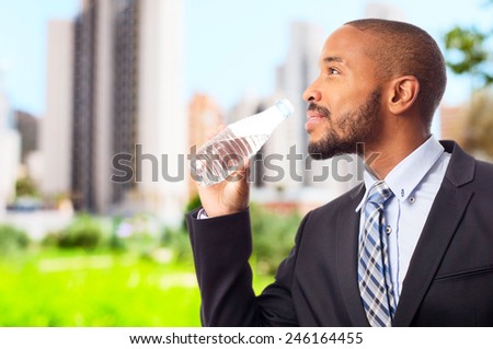 young cool black man drinking water