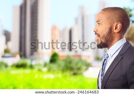 young cool black man looking surprised