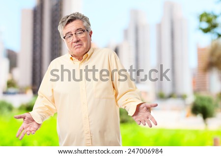 senior cool man confused pose