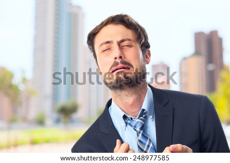 young crazy businessman crying