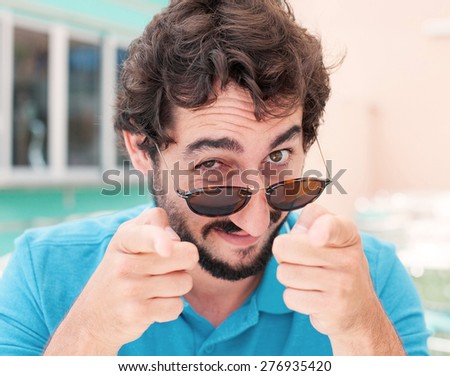young man pointing you in a restaurant