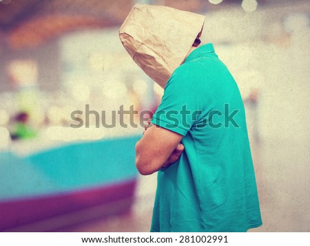 crazy man with paper bag in his head. angry or sad concept