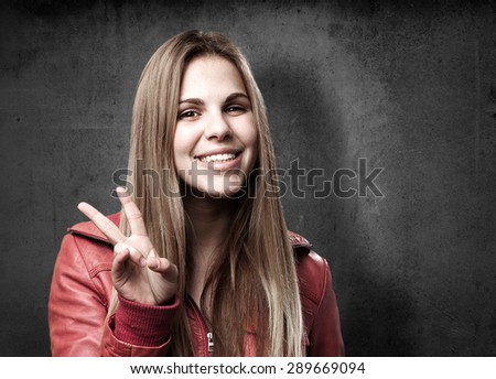 blond woman victory sign