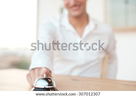 happy young man with ring bell