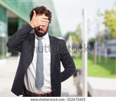 sad businessman covering eyes