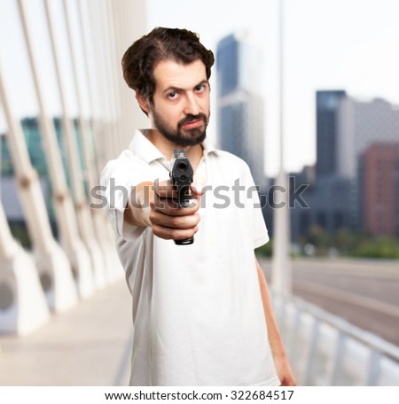 angry young man with gun