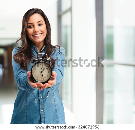 happy young woman with clock