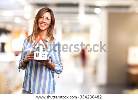 happy young woman with house