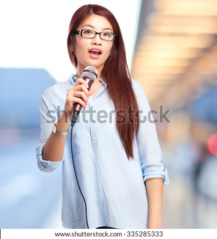 happy chinese woman with microphone