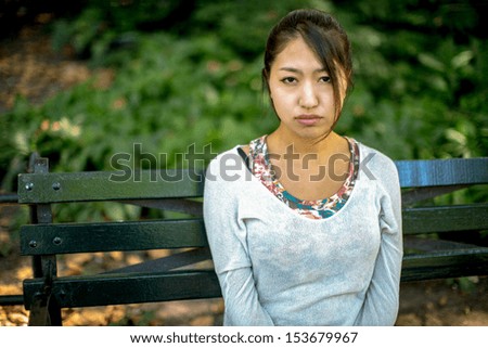 Asian woman sad face