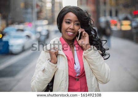 African American black cosmopolitan woman in New York City talking on cellphone