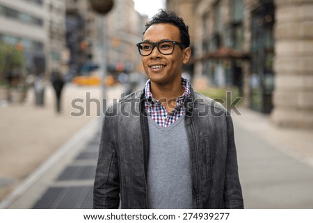 Young black African Asian man in city smile happy face portrait