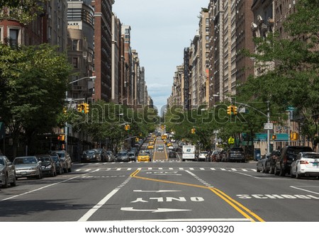 NEW YORK - CIRCA AUGUST 2015: Street traffic and apartment buildings in upper west side