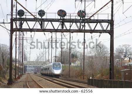 A commuter train passes the signal bridge at Prospect Park, PA.