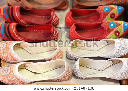 Nepalese colorist slippers and ballerina shoes with rhinestones set for sale in the shopwindow of a local store in a street of Pokhara city-Kaski distr.-Gandaki zone-Nepal.