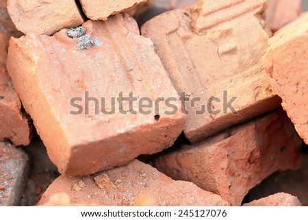 Building materials: red bricks for construction piled on the floor of a street in Godawari-Lalitpur distr.-Bagmati zone-Nepal.