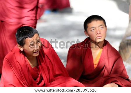 SERA, TIBET, CHINA - OCTOBER 19: Monks debate on doctrine-learning process-better comprehension of philosophy on October 19, 2012. Sera-Wild Roses monast.of Gelugpa-Yellow Hat order. Lhasa pref.-Tibet