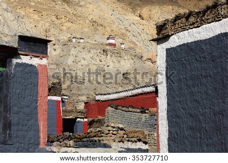 Grey-red-white painted buildings. Grounds of the 1073 AD-Khon Konchog founded North Seat of Sakya-Grey Soil monastery. Slope of Ponpori Hill over the right bank of Trum or Chong Chu-river. Sakya-Tibet