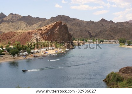 RV campsite in the lower Colorado between Lake Havasu and Parker with boat and jetski