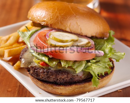 gourmet cheeseburger served open faced with selective focus on burger
