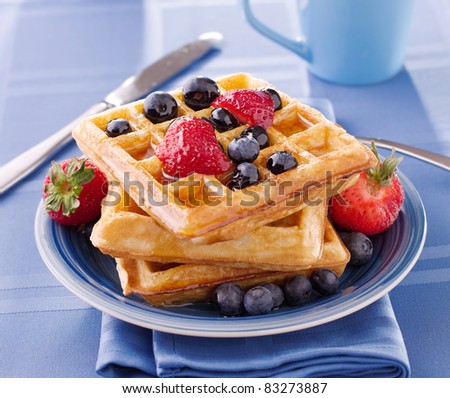 blueberry waffles with strawberries for breakfast