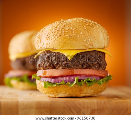 thick cheeseburgers with sesame seed bun