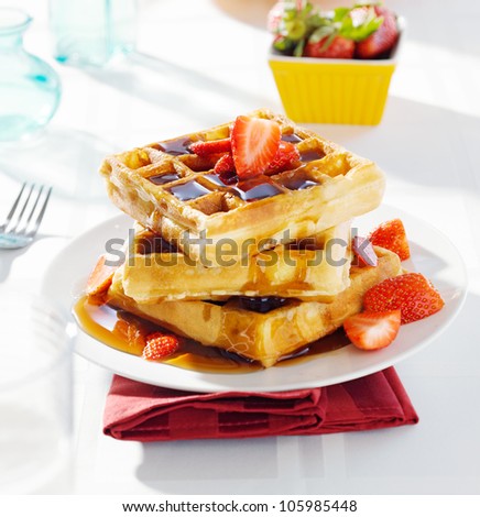 breakfast - waffles with syrup and strawberries