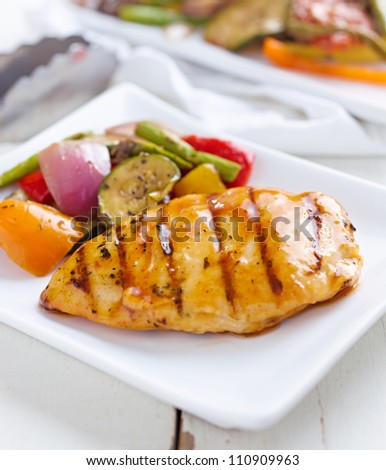 barbecue chicken with fresh vegetable sides