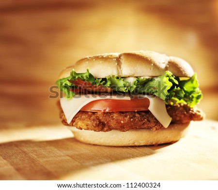 crispy chicken sandwich with bacon and swiss cheese.