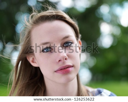 pretty teen girl face close up with blowing wind