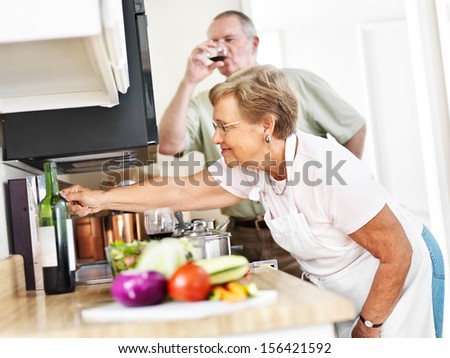 seniors cooking in kitchen at home