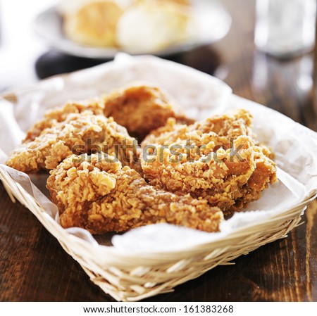 Fried Chicken Pile In A Basket On Table