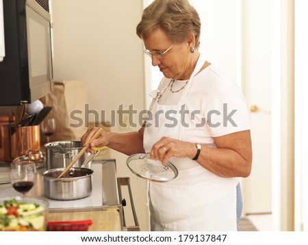 elderly grandmother cooking in the kitchen